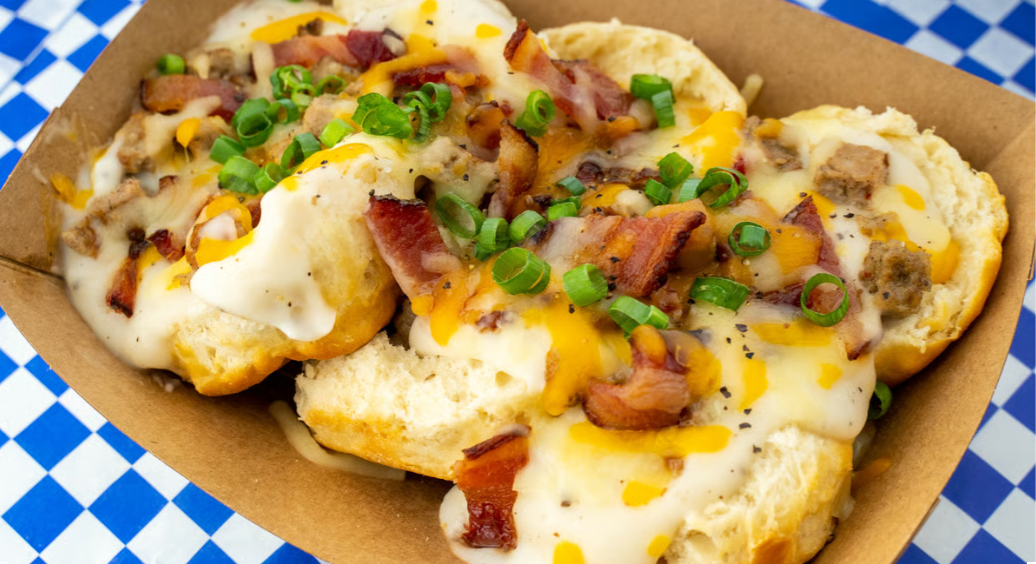 The Aretha biscuits and gravy – Austin brunch with sausage, bacon, and Colby Jack cheese from Biscuits + Groovy