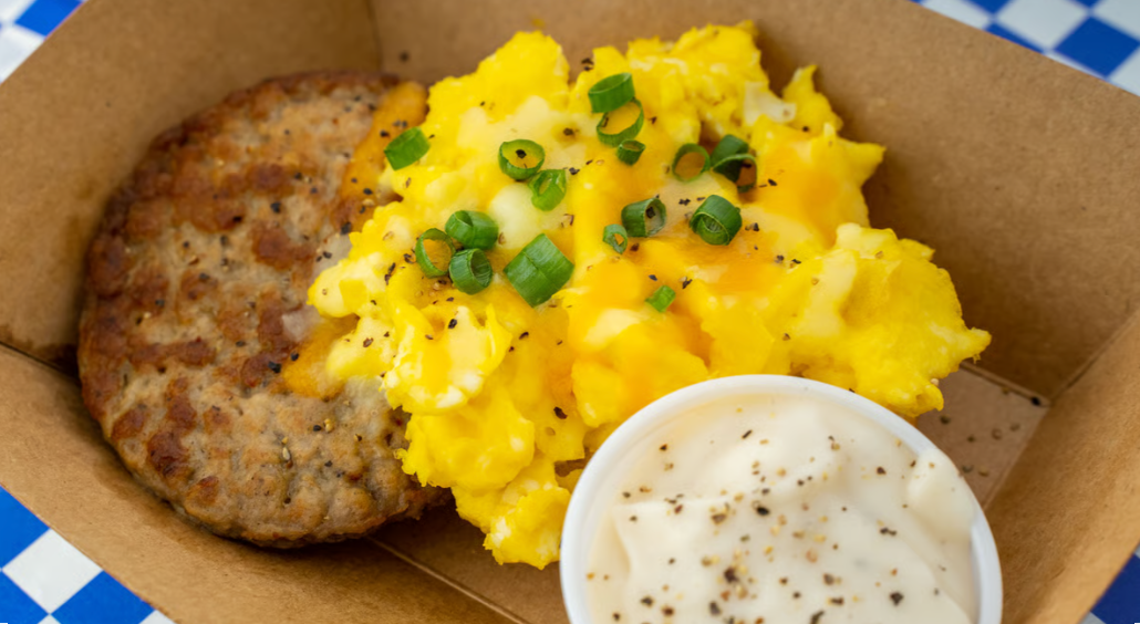 The Hammer open-faced biscuit – Austin breakfast with eggs, meat, cheese, and gravy from Biscuits + Groovy