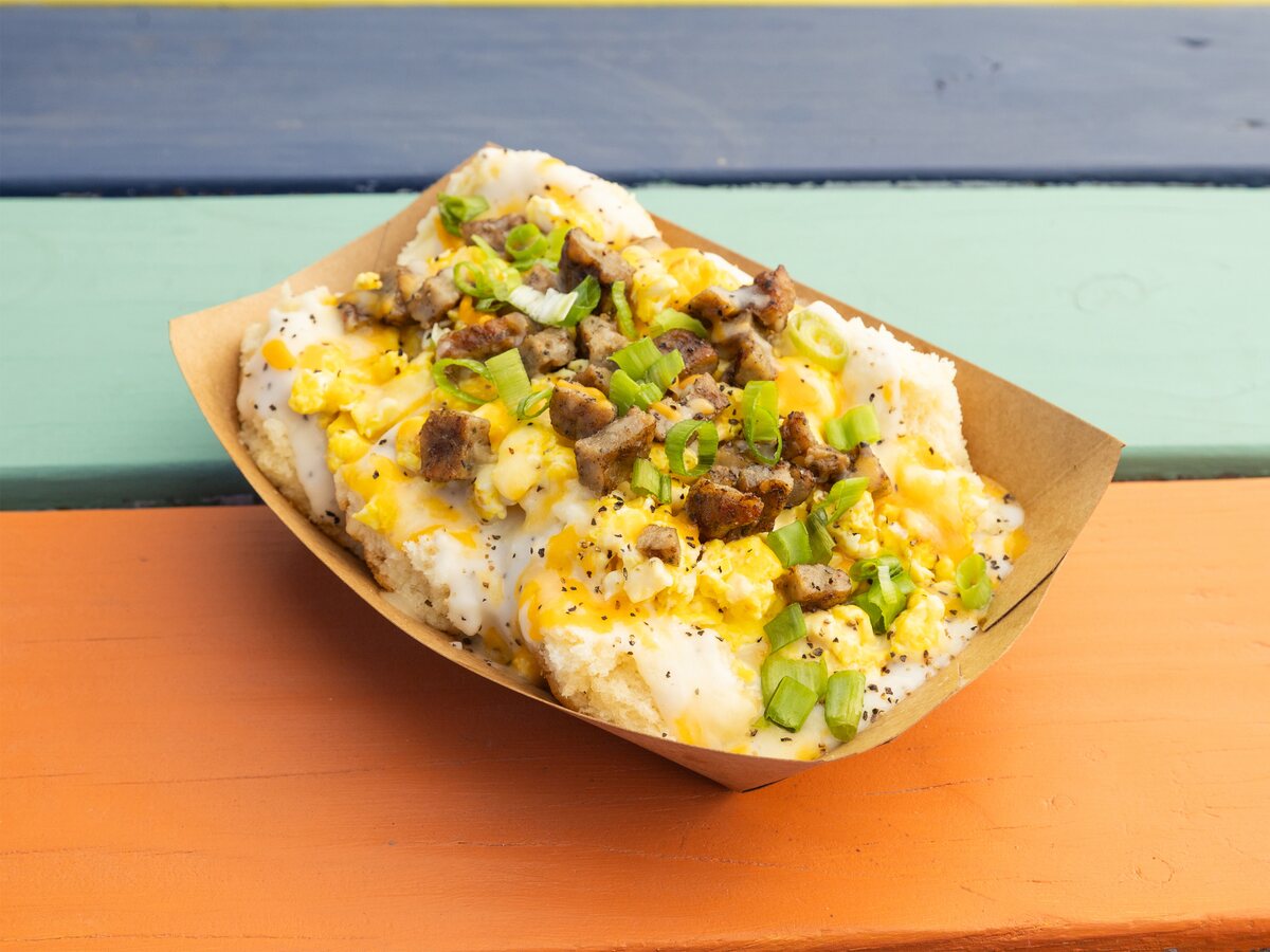 The Donna biscuits and gravy Austin breakfast with scrambled eggs, sausage, and cheese from Biscuits + Groovy