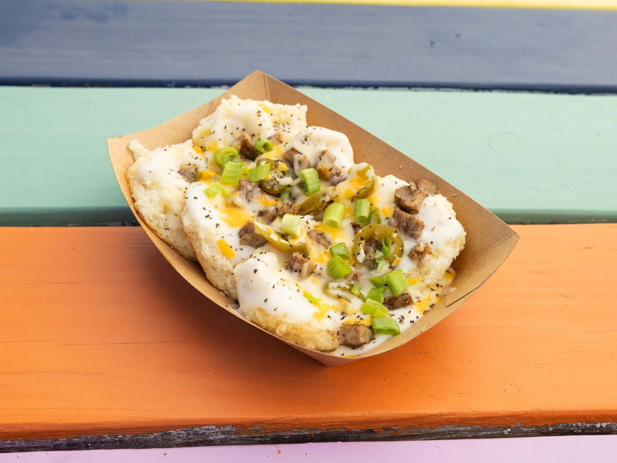 The Village biscuits and gravy Austin food truck favorite with sausage, jalapenos, and cheese from Biscuits + Groovy